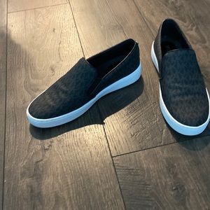 Michael Kors slip on sneakers. Black w/gray MK pattern. Size 8.5 womens (US)